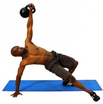 Photo of a fitness trainer executing a kettlebell move.